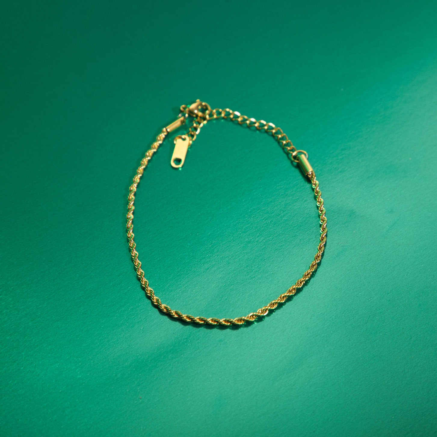 Image of the Twisted Chain Bracelet is crafted from 14K Gold Plated Stainless Steel, making it both non-tarnish and water resistant. It is also free from Nickel, Lead and Cadmium, ensuring a safe and durable design. Additionally, this bracelet is adjustable for a perfect fit.