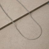 Image of the Twisted Rope Chain in Silver is crafted from durable stainless steel. It measures 45cm, 50cm, or 55cm in length and 3mm in width. Additionally, it is non-tarnishing, water-resistant, and safe for those with allergies.