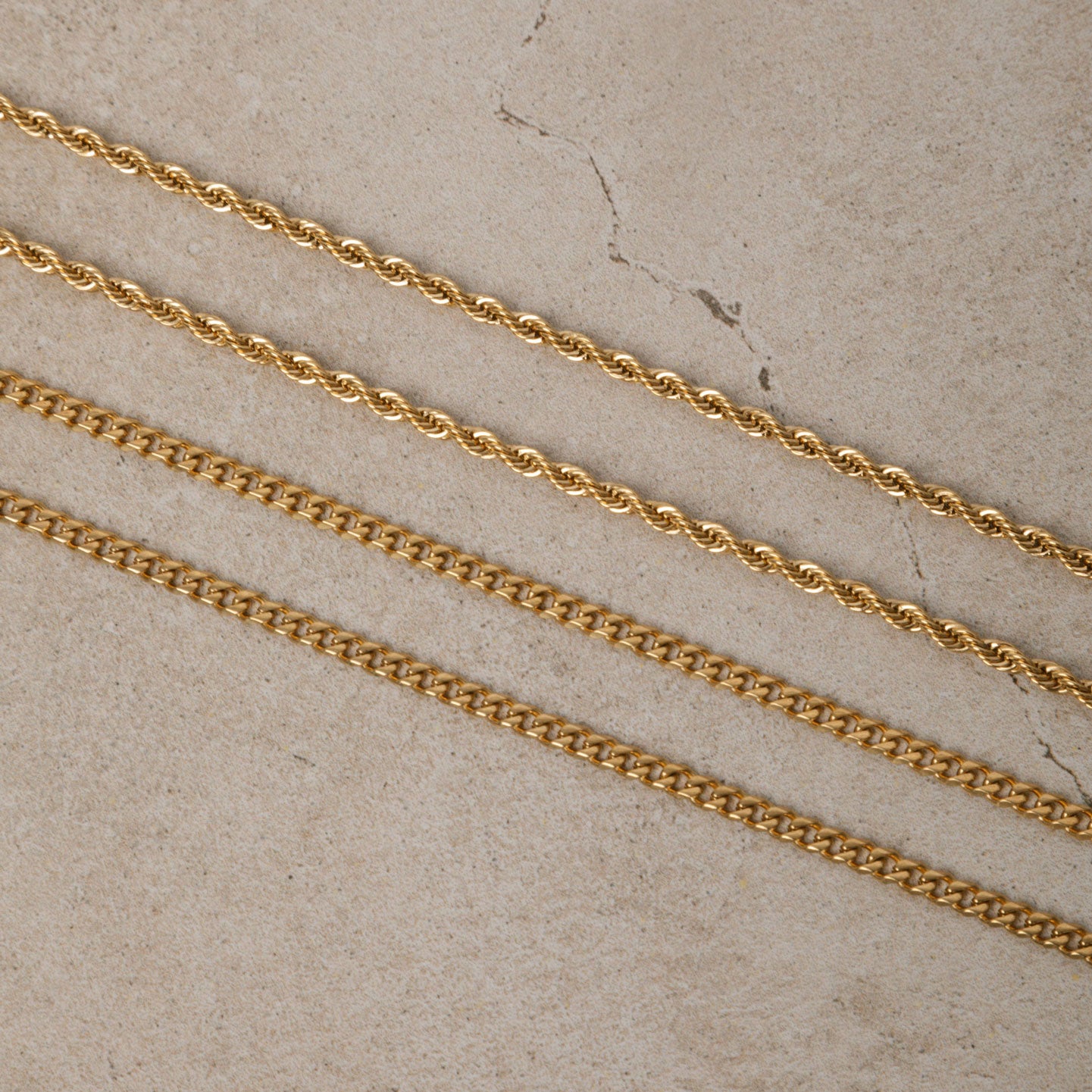 Image of the Cuban Chain in Gold is crafted from 18K Gold Plated material and is non-tarnish, water-resistant, and designed to be hypoallergenic.