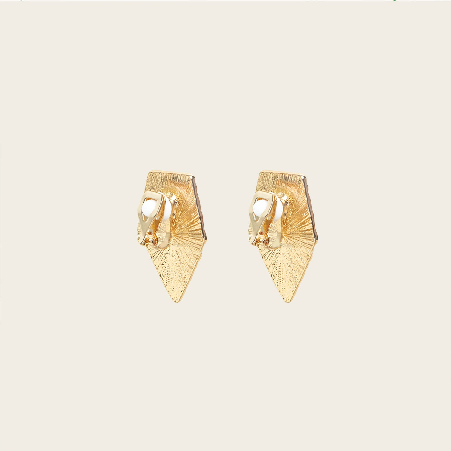 Image of the Vesper Clip On Earrings in Gold boast a secure padded clip-on closure, suitable for all ear types, with hold strength designed to last 8-12 hours. Crafted from zinc alloy and copper alloy, this single pair is adjustable and comfortable to wear.
