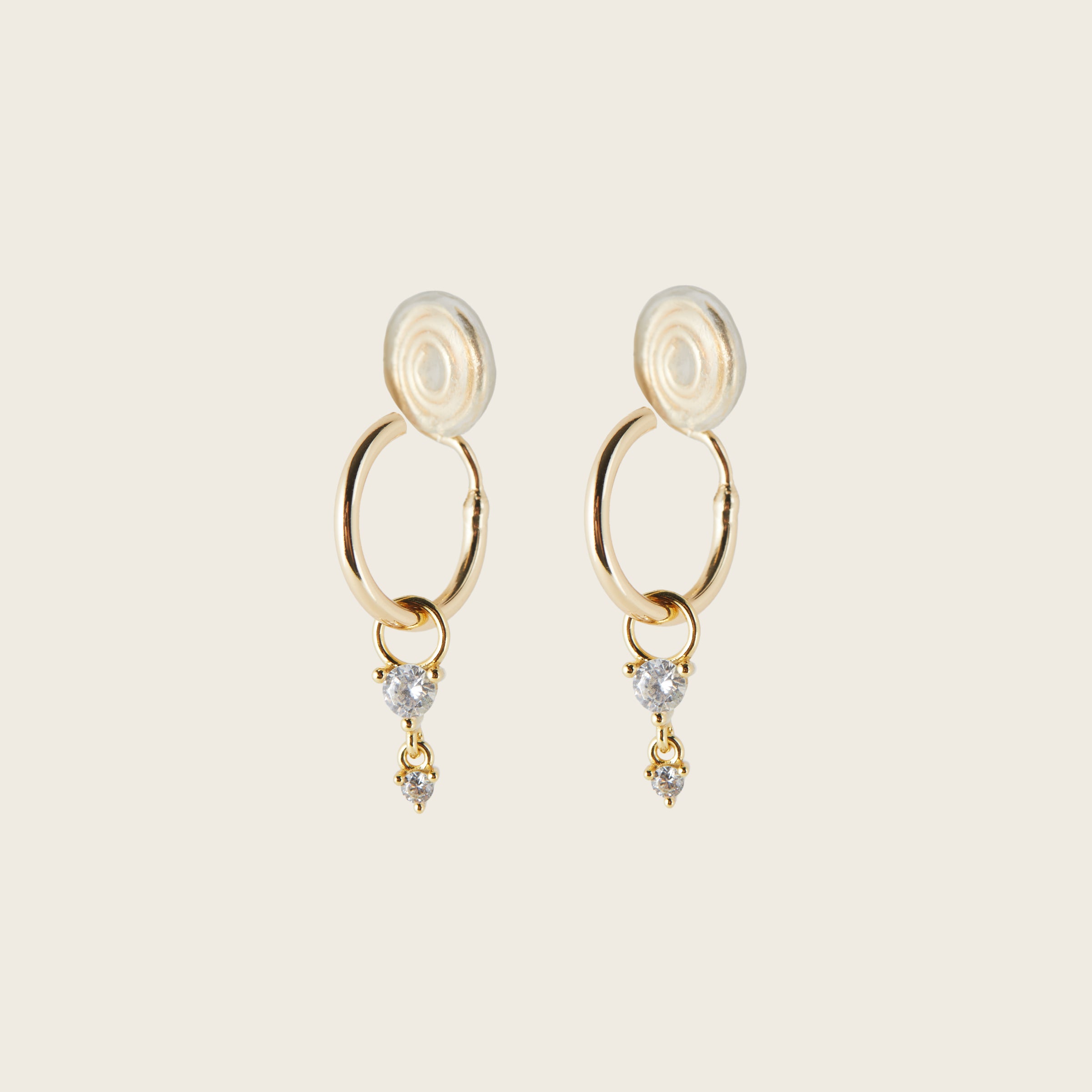 Image of the Cluster Hoop Charms in Gold are made with high-quality materials, including 18K gold plating over 925 Sterling Silver. These charms are both non-tarnish and water resistant. The perfect combination of style and durability.