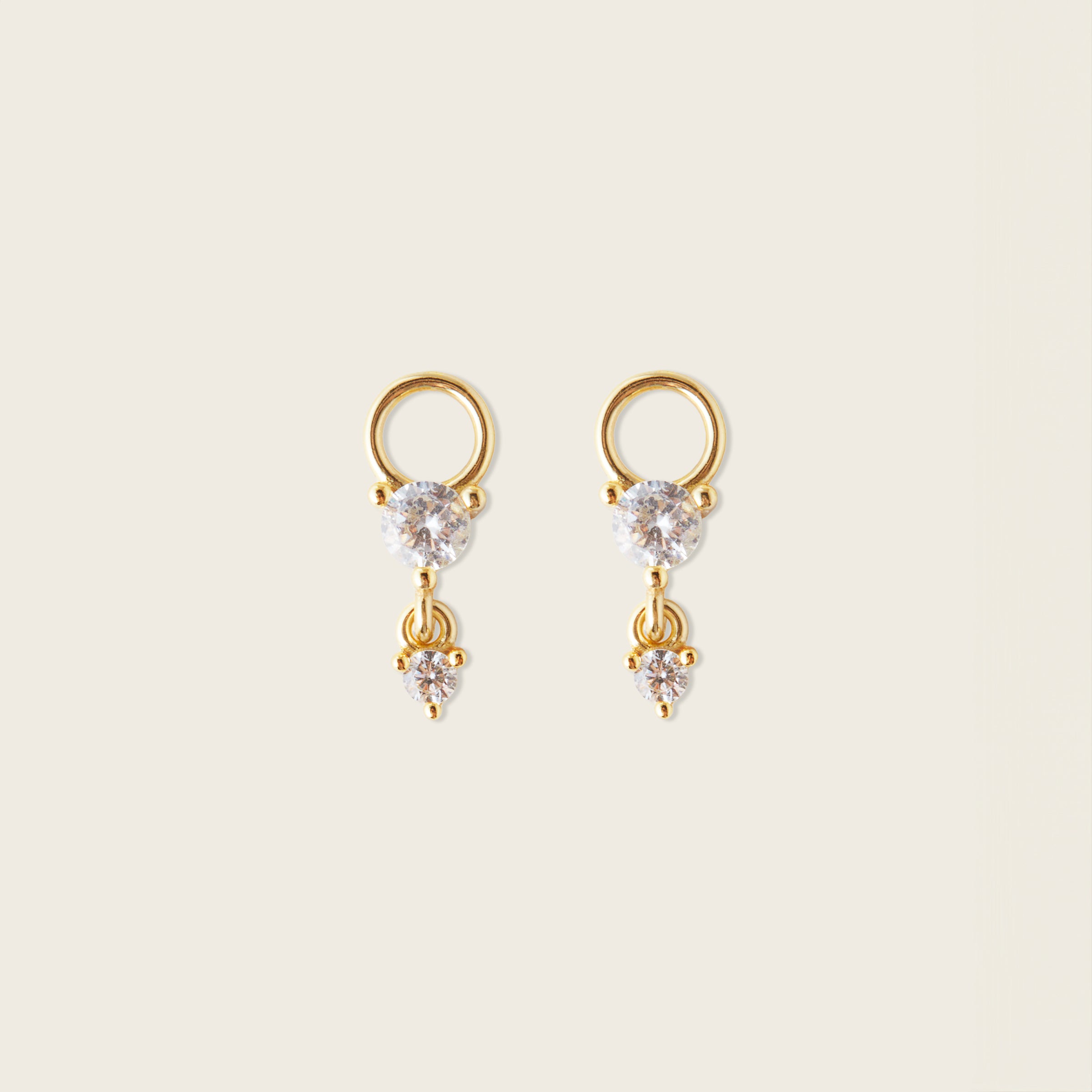 Image of the Cluster Hoop Charms in Gold are made with high-quality materials, including 18K gold plating over 925 Sterling Silver. These charms are both non-tarnish and water resistant. The perfect combination of style and durability.