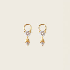 Image of the Cluster Hoop Charms in Gold are made with high-quality materials, including 18K gold plating over 925 Sterling Silver. These charms are both non-tarnish and water resistant. The perfect combination of style and durability.