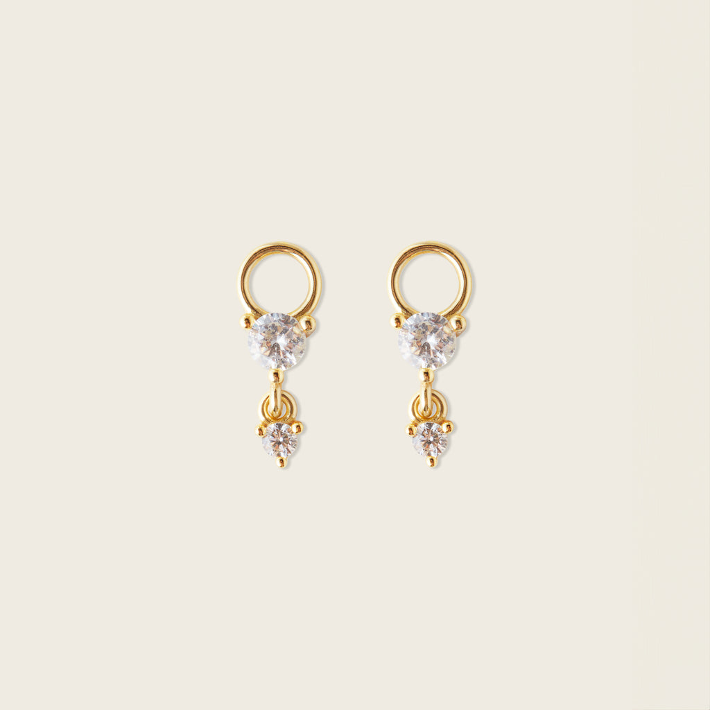 Image of the Cluster Hoop Charms in Gold are made with high-quality materials, including 18K gold plating over 925 Sterling Silver. These charms are both non-tarnish and water resistant. The perfect combination of style and durability.