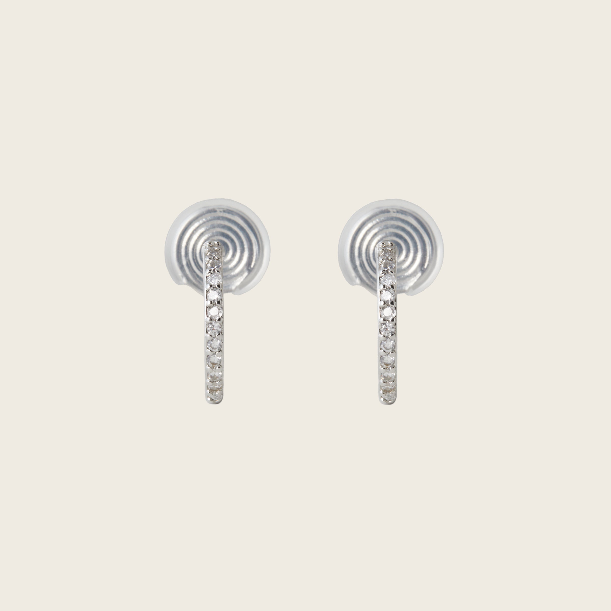 Image of the Medium Pavé Hoop Clip On Earrings in Silver offer a Mosquito Coil Clip-On Closure, making them ideal for Thick/Large Ears, Sensitive Ears, Small/Thin Ears, Stretched/Healing Ears, and Keloid Prone Ears. They provide an average comfortable wear duration of 24 hours with a medium secure hold, and can be gently adjusted by squeezing the padding forward once on the ear. Please note that this item is only one pair.