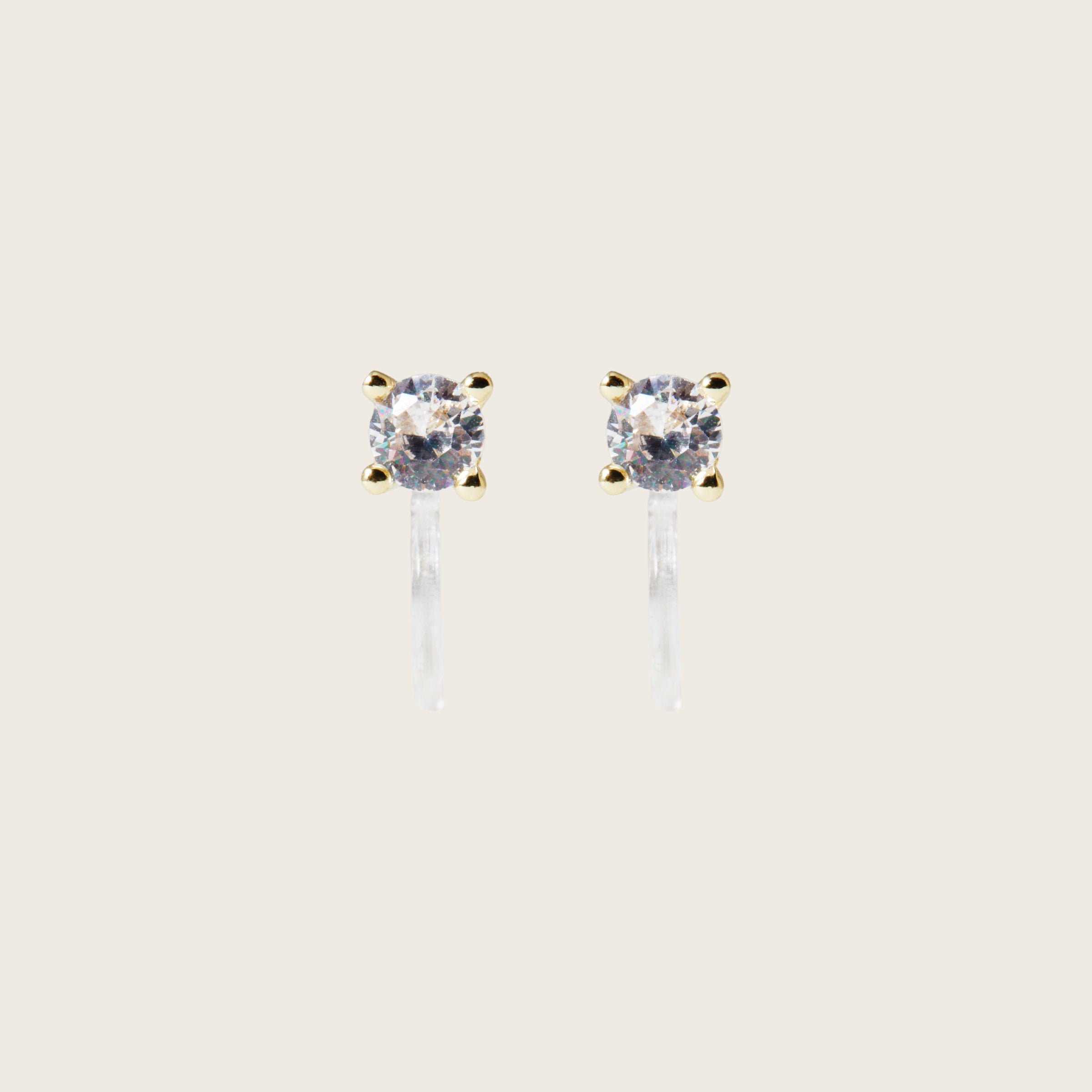 Image of the Mini Stud Clip-On Earrings possess a resin clip-on closure, making them suitable for a variety of ear types and offering a medium secure hold for comfortable wear lasting 8-12 hours. Please note that this item is a single pair.