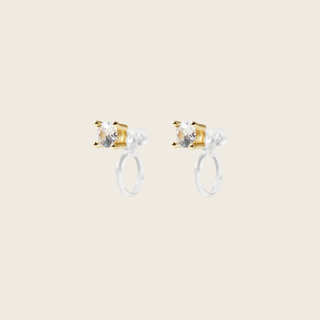 Image of the Mini Stud Clip-On Earrings possess a resin clip-on closure, making them suitable for a variety of ear types and offering a medium secure hold for comfortable wear lasting 8-12 hours. Please note that this item is a single pair.