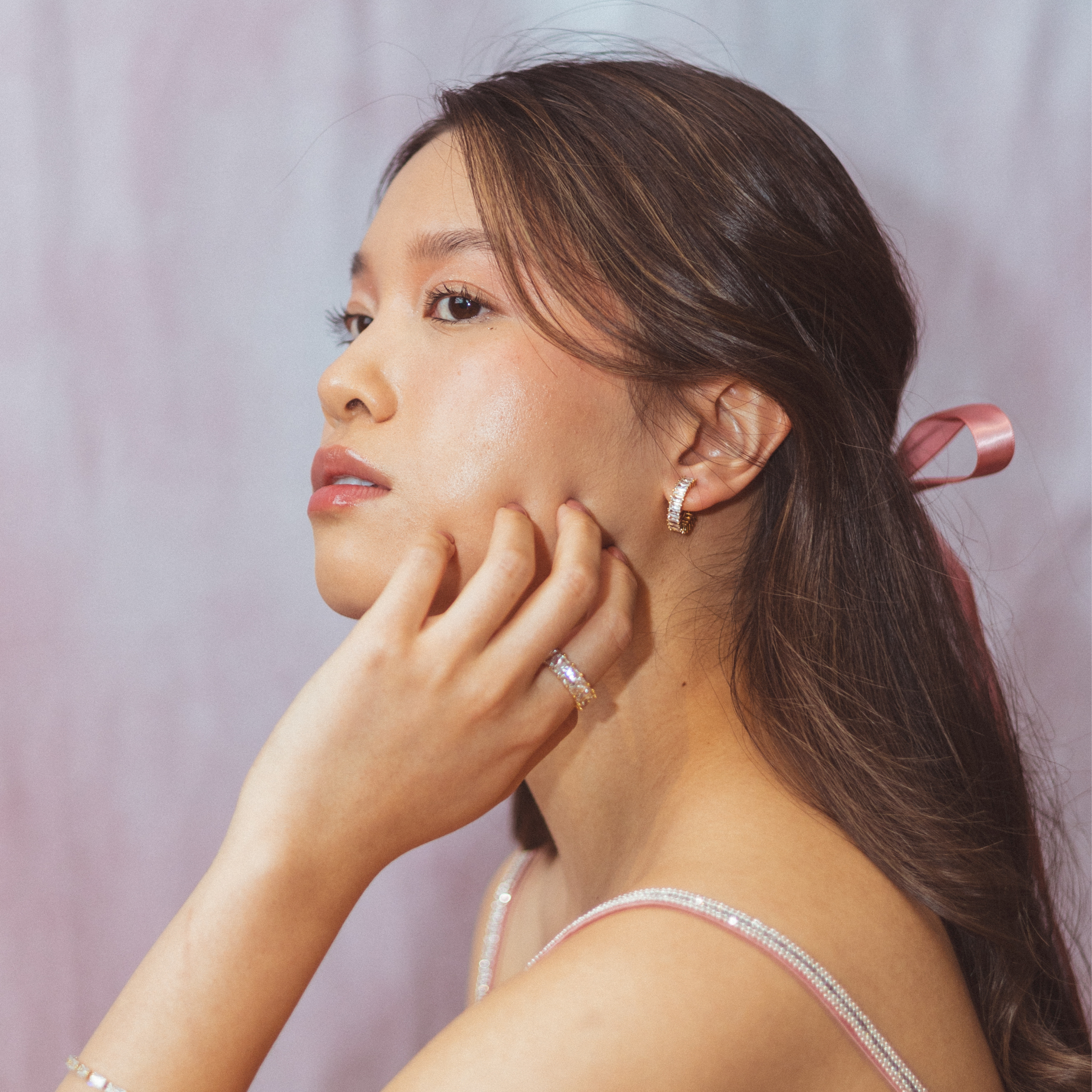 A model wearing the Olivia Clip On Earrings. These elegant earrings provide a secure 24-hour hold and adjustable fit for all types of ears, perfect for sensitive or stretched ears. Elevate your everyday look confidently with Olivia Clip On Earrings, designed for ultimate comfort and style.