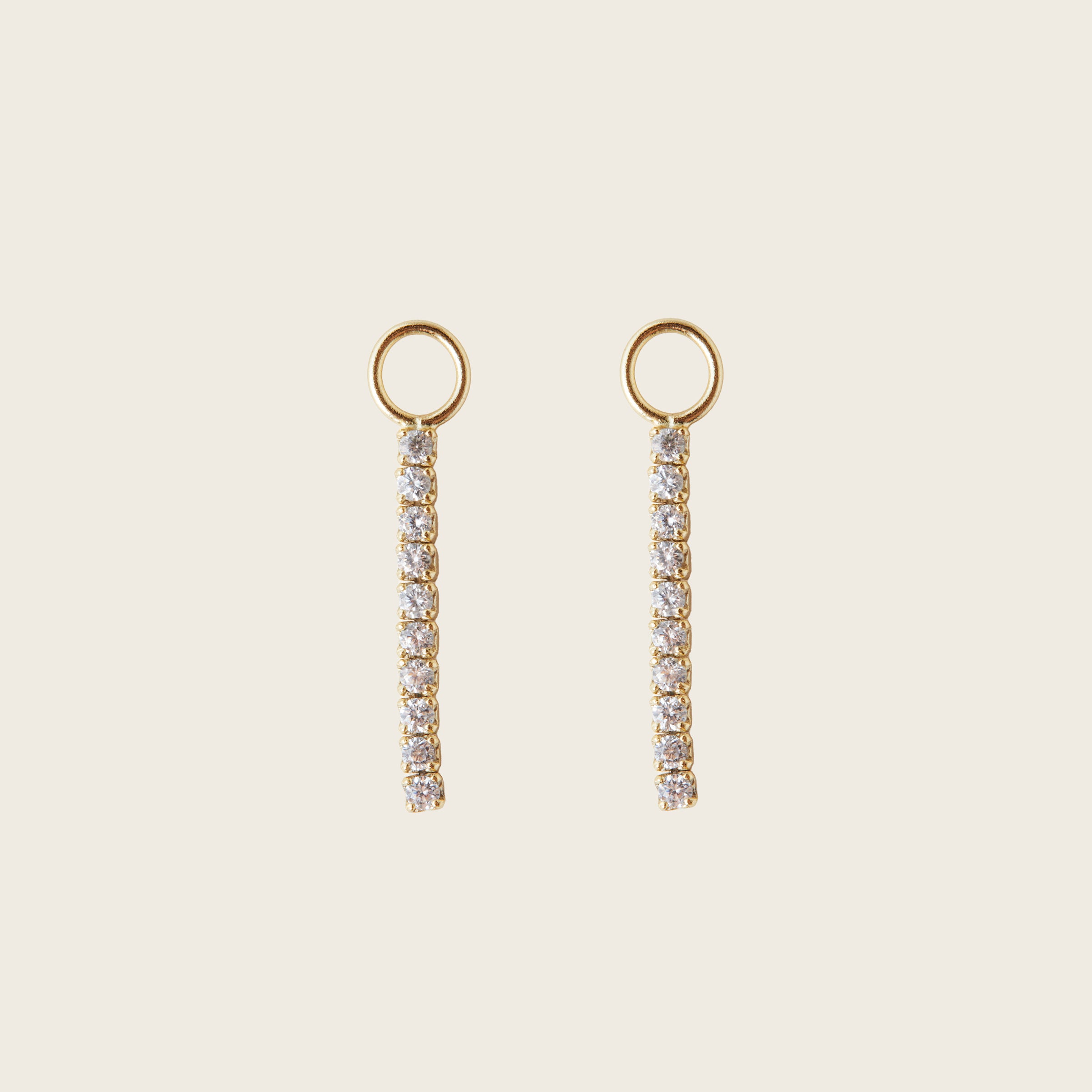 Image of the Pavé Bar Hoop Charms are made with high-quality materials, including 18K gold plating over 925 Sterling Silver. These charms are both non-tarnish and water resistant. The perfect combination of style and durability.