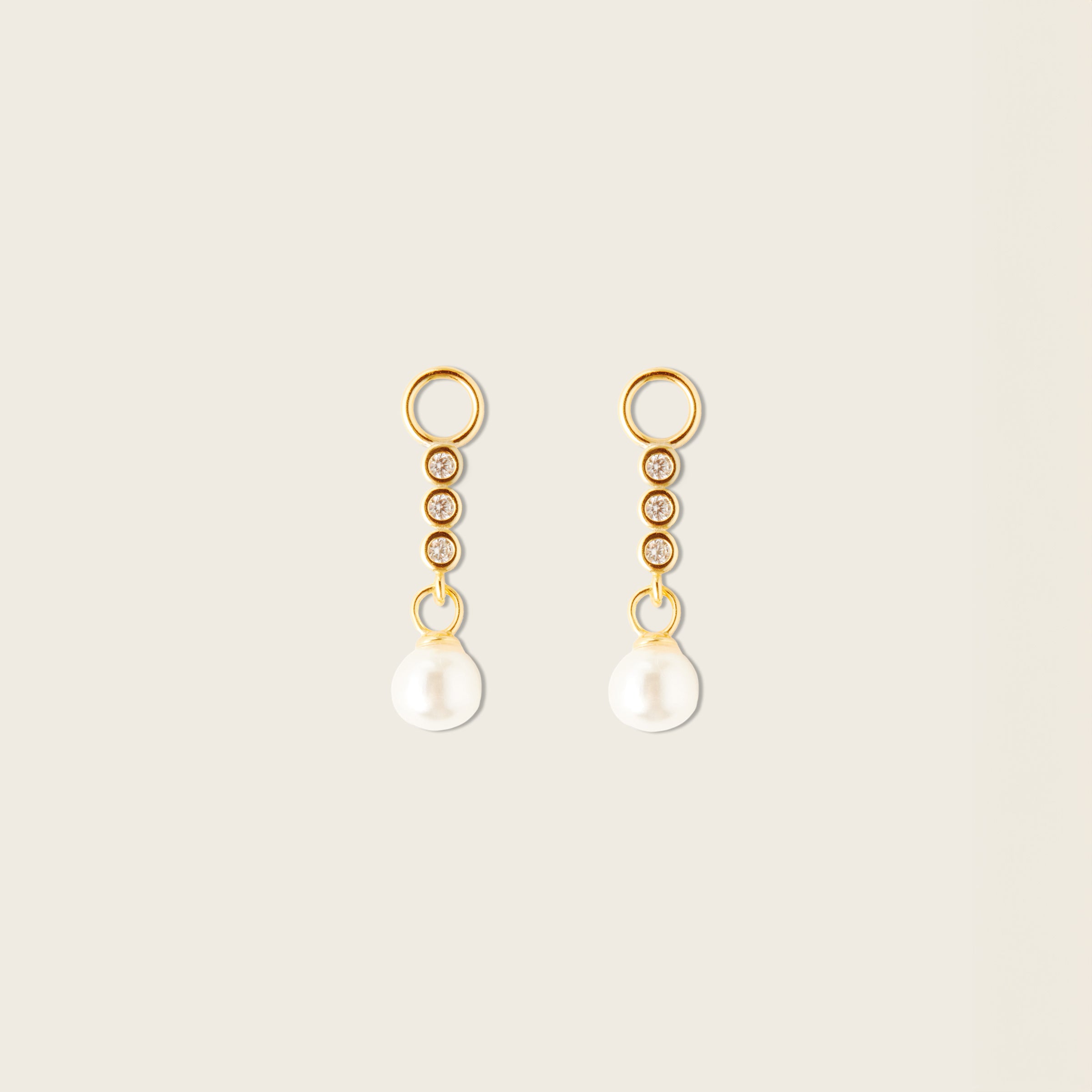 Image of the Pearl Dangle Hoop Charms are made with high-quality materials, including 18K gold plating over 925 Sterling Silver. These charms are both non-tarnish and water resistant. The perfect combination of style and durability.