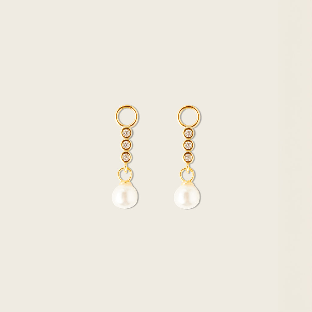 Image of the Pearl Dangle Hoop Charms are made with high-quality materials, including 18K gold plating over 925 Sterling Silver. These charms are both non-tarnish and water resistant. The perfect combination of style and durability.