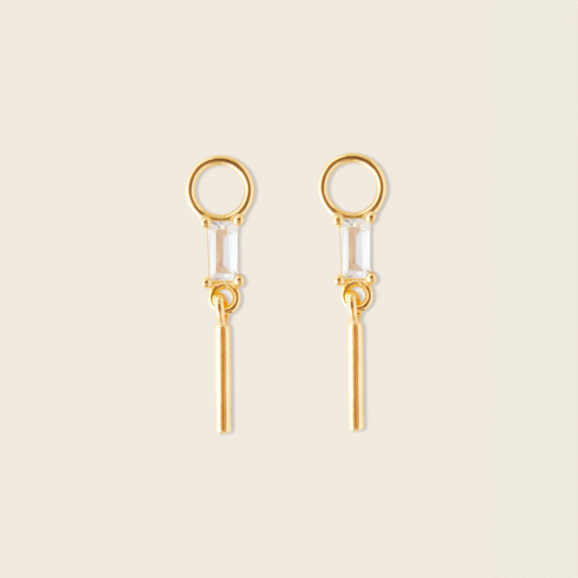Image of the Rectangle Drop Hoop Charms are made with high-quality materials, including 18K gold plating over 925 Sterling Silver. These charms are both non-tarnish and water resistant. The perfect combination of style and durability.