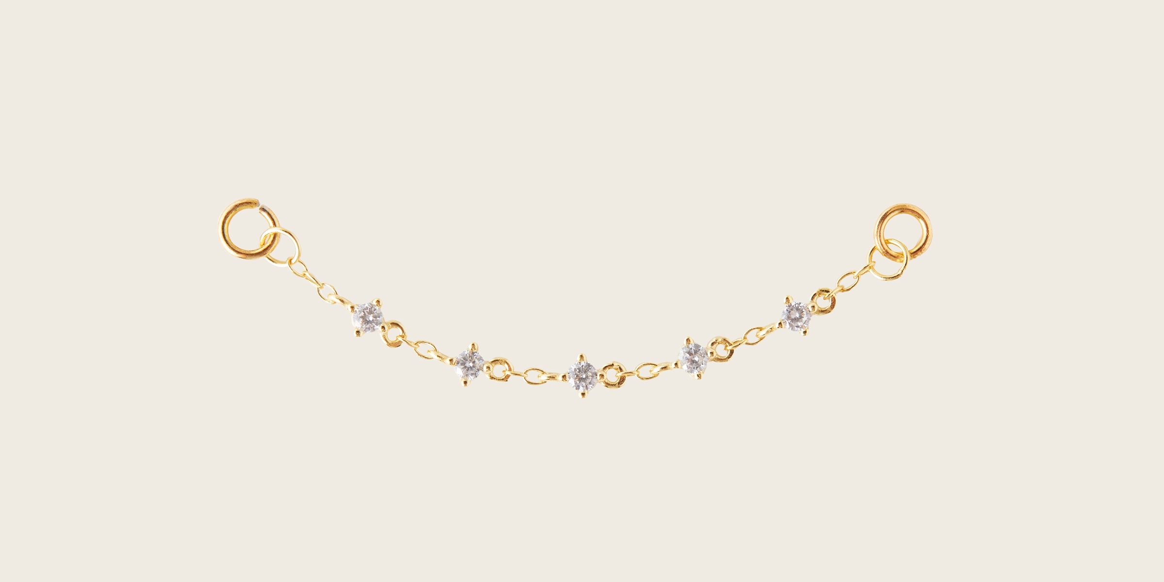 Image of the Single Cluster Hoop Chain are made with high-quality materials, including 18K gold plating over 925 Sterling Silver. These charms are both non-tarnish and water resistant. The perfect combination of style and durability.