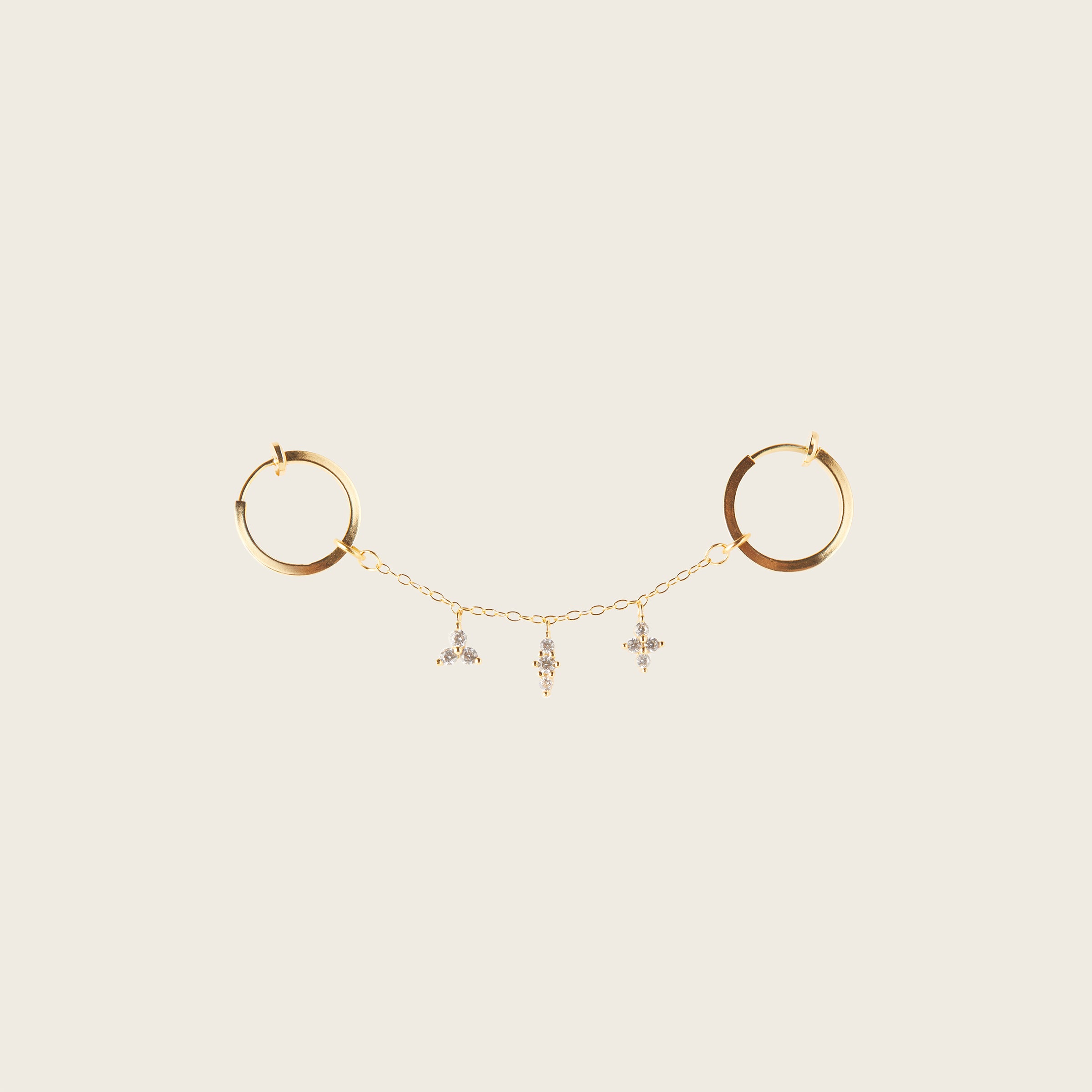 Image of the Single Triple Charm Hoop Chain in Gold are made with high-quality materials, including 18K gold plating over 925 Sterling Silver. These charms are both non-tarnish and water resistant. The perfect combination of style and durability.