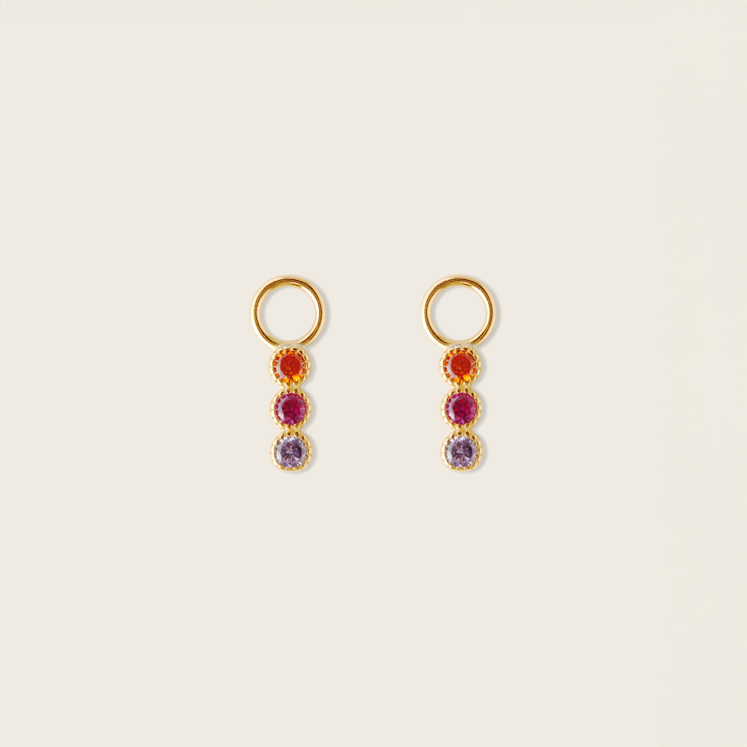 Image of the Sunset Hoop Charms are made with high-quality materials, including 18K gold plating over 925 Sterling Silver. These charms are both non-tarnish and water resistant. The perfect combination of style and durability.