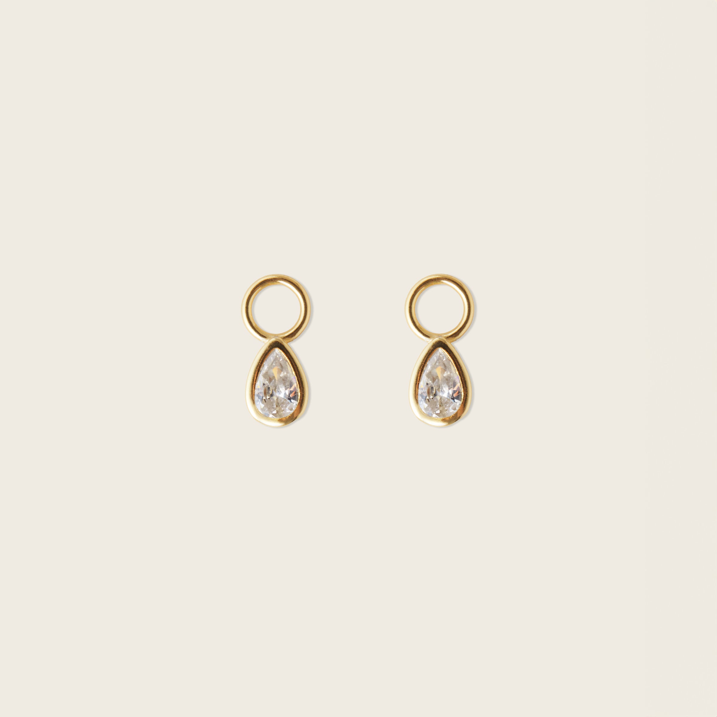 Image of the Teardrop Hoop Charms are made with high-quality materials, including 18K gold plating over 925 Sterling Silver. These charms are both non-tarnish and water resistant. The perfect combination of style and durability.