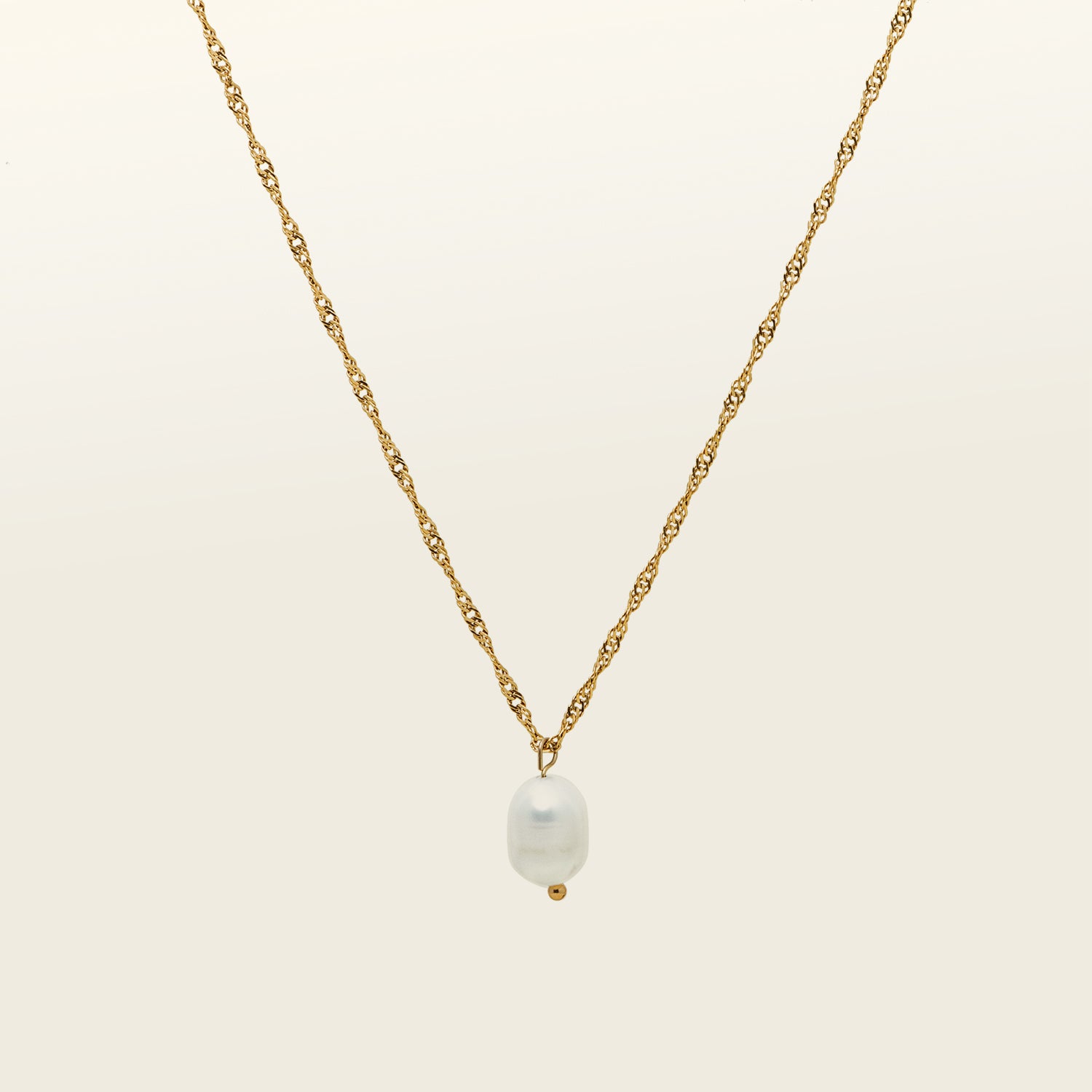 Image of the Ava Pearl Necklace, an elegant piece, decorated with a Freshwater Pearl and framed in 18K Gold Plated Stainless Steel. Its water-resistance and hypoallergenic qualities make it a luxurious and comfortable complement to any jewelry repertoire.