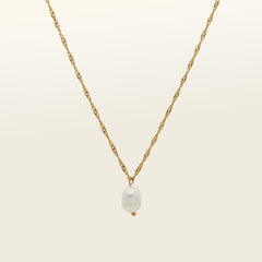 Image of the Ava Pearl Necklace, an elegant piece, decorated with a Freshwater Pearl and framed in 18K Gold Plated Stainless Steel. Its water-resistance and hypoallergenic qualities make it a luxurious and comfortable complement to any jewelry repertoire.