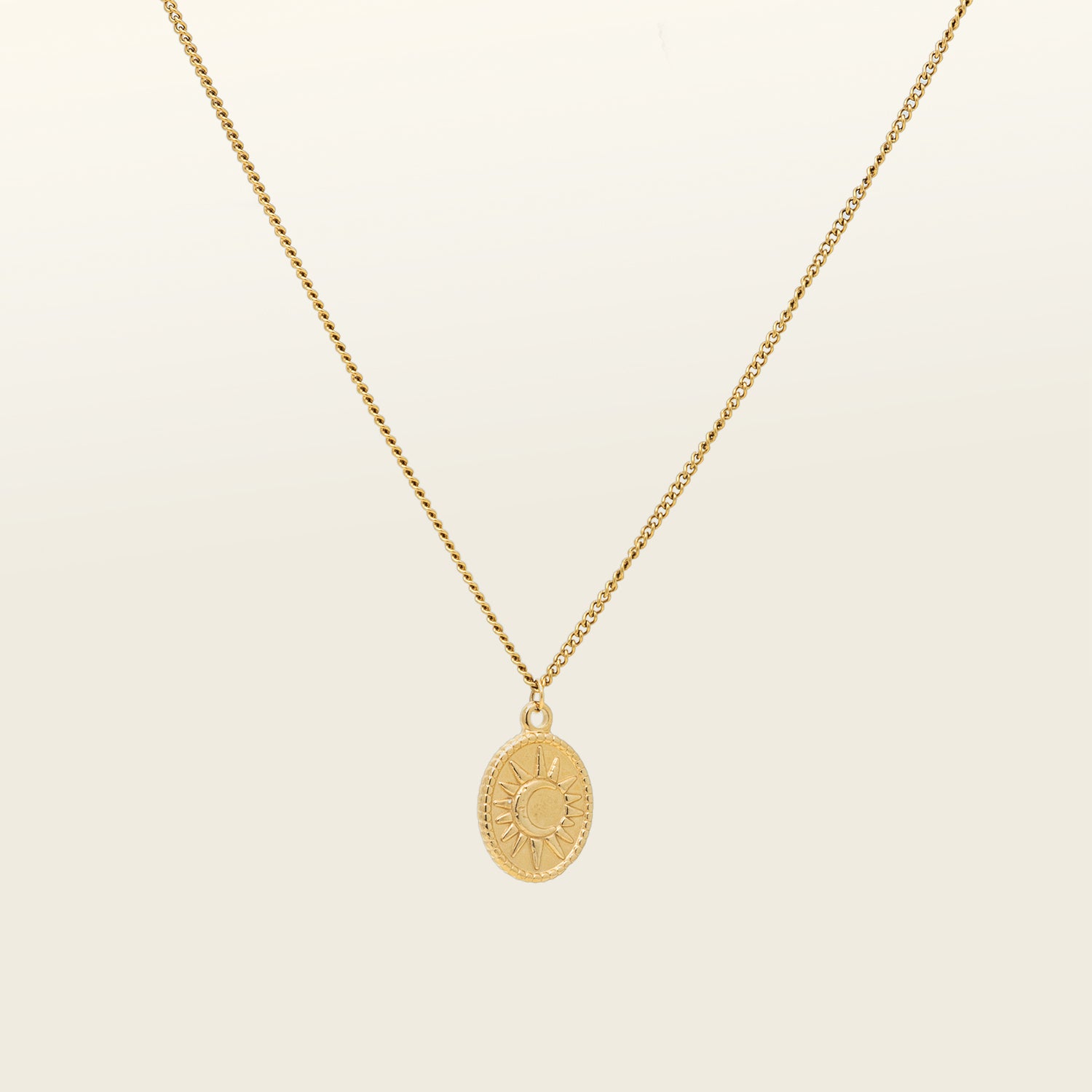 Product catalogue photo of a gold plated necklace with celestial markings. This necklace is made of 18k gold plated vermeil on stainless steel and is tarnish free and waterproof.