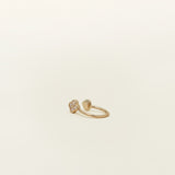 Image of the Gold Clover Ear Cuff, a chic and versatile accessory. Made from Gold or Silver Plated Copper alloy, this modern clover-shaped ear cuff features 4 sparkling Cubic Zirconia stones. Ideal for both the nose and ear, it effortlessly adds sophistication to any outfit, allowing you to adorn yourself with style and flair.