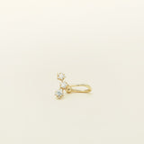 Image of the Constellation Ear Cuff in gold, a captivating and modern accessory that elevates your style. Crafted from copper alloy and available in gold or silver plating, this ear cuff boasts a celestial Constellation shape adorned with three sparkling cubic zirconia stars. Suitable for all genders, this stylish design is guaranteed to add an elegant and celestial touch to any outfit, making it a standout piece in your collection.