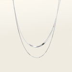 Image of the Double Layered Chain Necklace In Silver is adjustable, constructed of stainless steel and is waterproof and non-tarnish. It is also available in Gold.