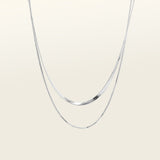 Image of the Double Layered Chain Necklace In Silver is adjustable, constructed of stainless steel and is waterproof and non-tarnish. It is also available in Gold.