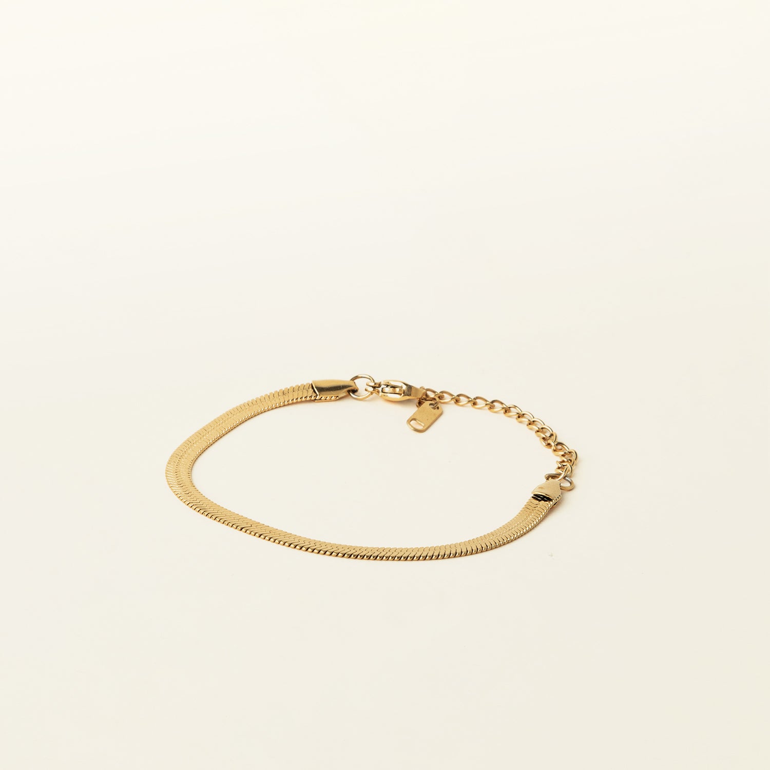 Image of the Herringbone Chain Bracelet is crafted with 18K Gold Plated on 316L Stainless Steel, making it non-tarnish, water resistant, nickel-free, and hypoallergenic. It has an adjustable feature, but it is sold as a single bracelet.