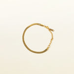 Image of the Herringbone Chain Bracelet is crafted with 18K Gold Plated on 316L Stainless Steel, making it non-tarnish, water resistant, nickel-free, and hypoallergenic. It has an adjustable feature, but it is sold as a single bracelet.