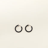 Image of the Mini Hoop Clip-On Earrings feature a sliding spring closure and are best suited for those with smaller or thinner ear lobes. On average, each pair can be comfortably worn for up to 4 hours, and provide a very secure hold that automatically adjusts to the ear thickness for a perfect fit. Crafted with stainless steel, each pair is sold individually.