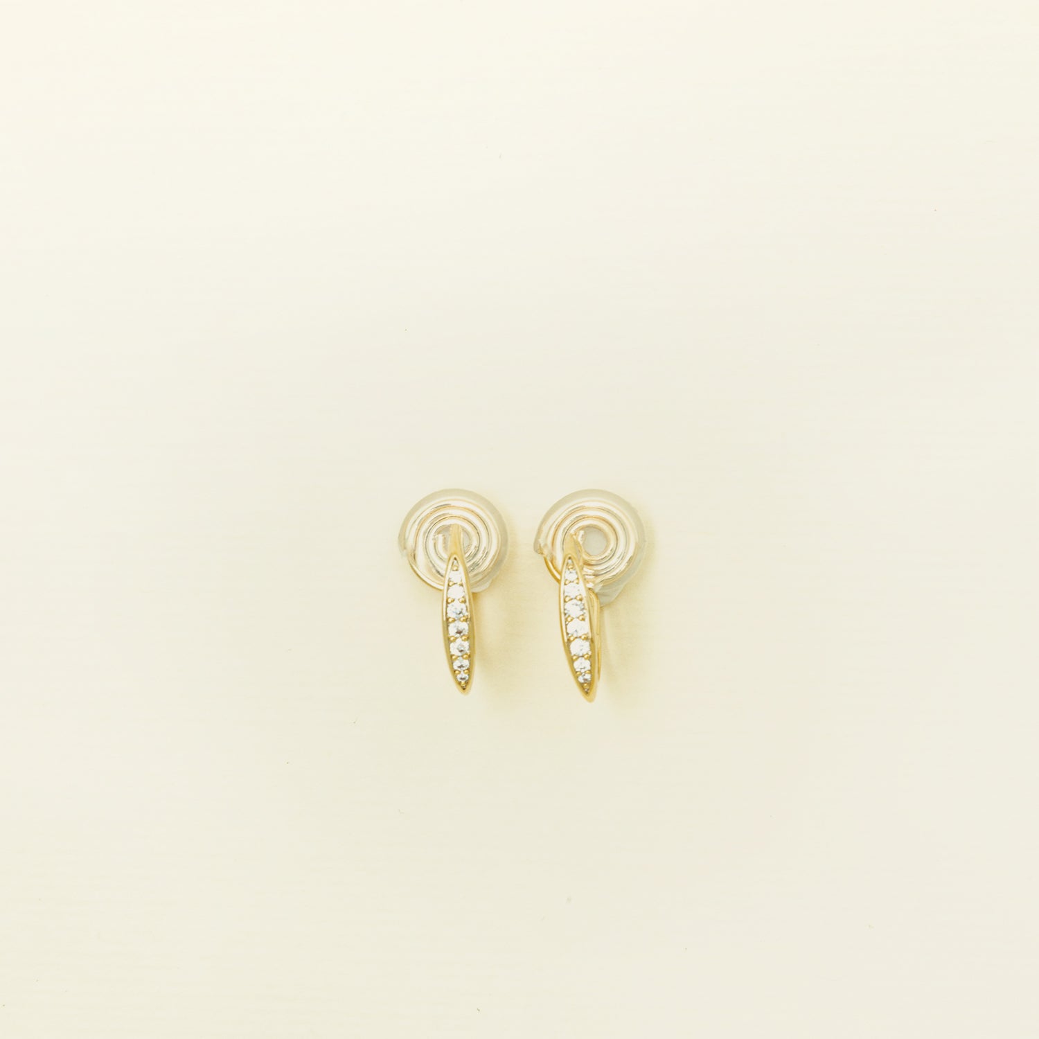 Catalogue Image of the Mini Pavé Huggie Clip-On Earrings - 14k gold-plated alloy with cubic zirconia, non-tarnish, water-resistant, and discreet mosquito coil closure for a regal touch.