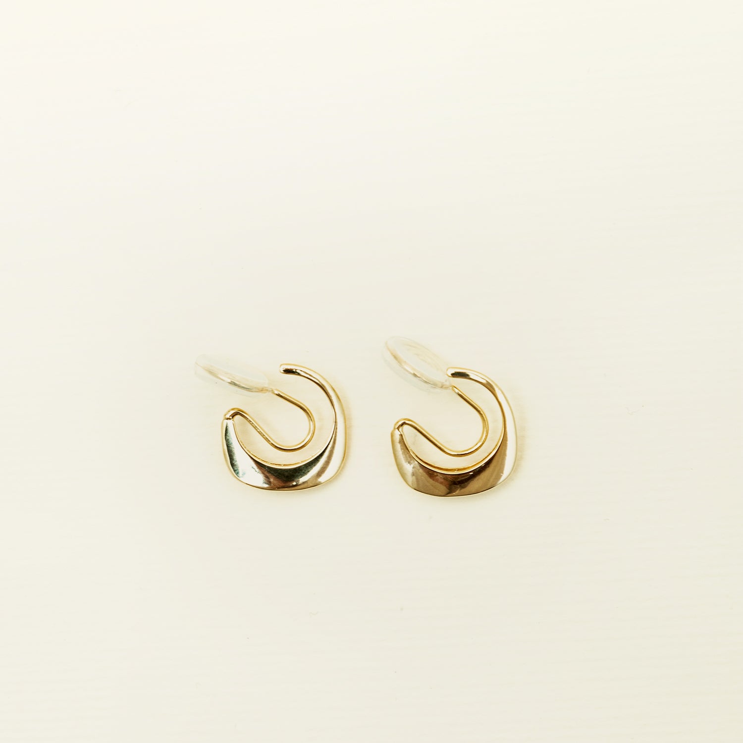 Catalogue Image of the Mini Pavé Huggie Clip-On Earrings - 14k gold-plated alloy with cubic zirconia, non-tarnish, water-resistant, and discreet mosquito coil closure for a regal touch.