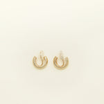 Image of the Simple Gold Huggie Clip-On Earrings feature a mosquito coil closure ideal for all ear types, providing a medium-secure hold and comfortable wear for up to 24 hours. These earrings can be adjusted with a gentle squeeze of the padding forward once on the ear. Crafted with Gold tone plated copper alloy, these sophisticated earrings are also available in Silver.