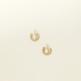 Image of the Simple Gold Huggie Clip-On Earrings feature a mosquito coil closure ideal for all ear types, providing a medium-secure hold and comfortable wear for up to 24 hours. These earrings can be adjusted with a gentle squeeze of the padding forward once on the ear. Crafted with Gold tone plated copper alloy, these sophisticated earrings are also available in Silver.