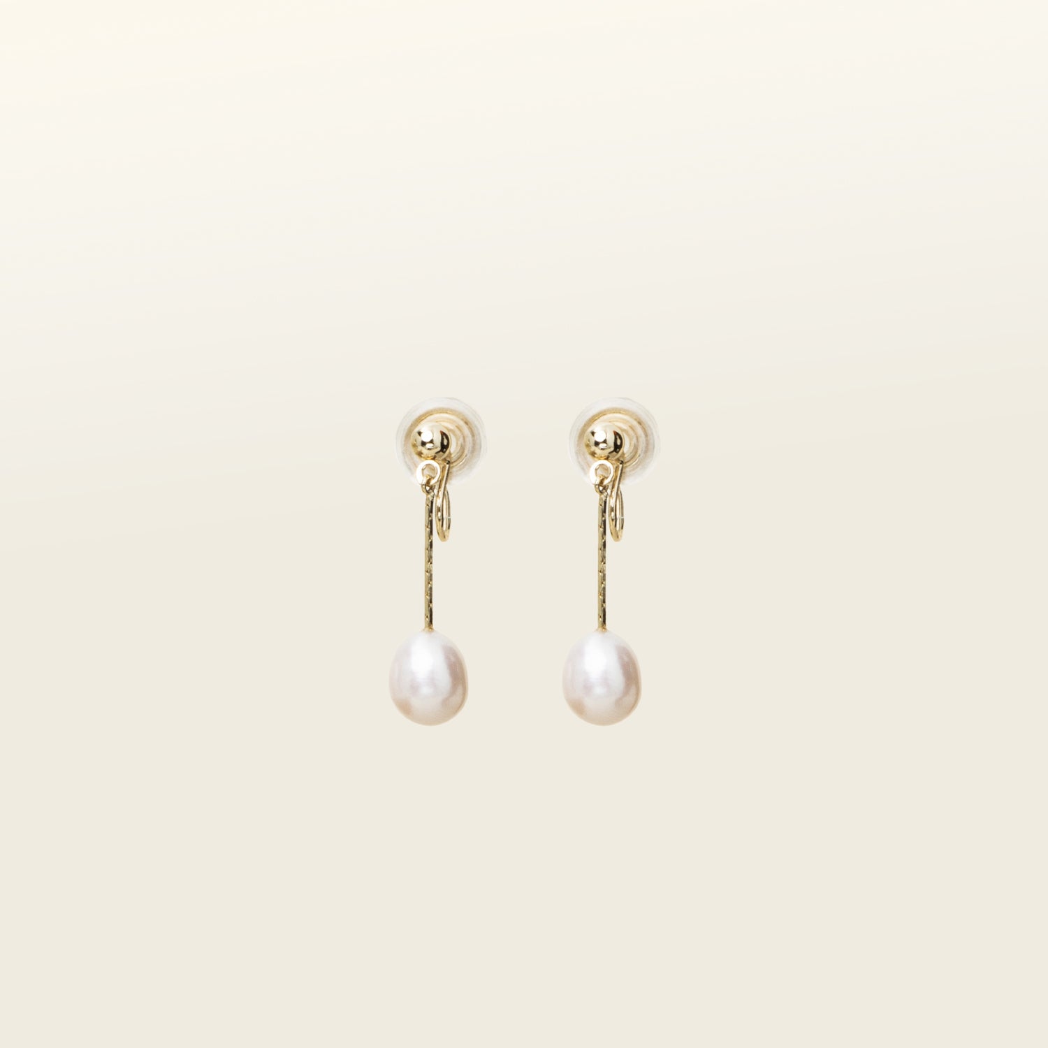 Elegant gold-plated clip-on earrings featuring Freshwater Pearls. Ideal for all ear types, with a medium secure hold and adjustable padding for comfort. 