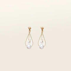 Image of the Camilla Clip-On Earrings, these alluring screwback clip-on earrings boast a gleaming gold-plated metal alloy and faux pearl, rendering them an exquisite accessory for all ear types. Synergizing with a variety of looks, these figure-eight hoop earrings are ideal for thick/large, sensitive, small/thin, and stretched/healing ears, making them a must-have for any chic ensemble.