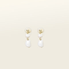 Image of the Duo Pearl Clip-On Earrings in Gold feature a mosquito coil clip-on closure ideal for all ear types. Enjoy medium secure hold and comfortable wear for up to 24 hours - gently squeezing the padding forward once on the ear for adjustable fit. Crafted with freshwater pearls and 18K gold plated stainless steel, each piece features unique natural variations in size and colour.
