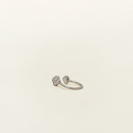 Image of the Silver Clover Ear Cuff, a chic and versatile accessory. Made from Gold or Silver Plated Copper alloy, this modern clover-shaped ear cuff features 4 sparkling Cubic Zirconia stones. Ideal for both the nose and ear, it effortlessly adds sophistication to any outfit, allowing you to adorn yourself with style and flair.