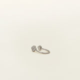 Image of the Silver Clover Ear Cuff, a chic and versatile accessory. Made from Gold or Silver Plated Copper alloy, this modern clover-shaped ear cuff features 4 sparkling Cubic Zirconia stones. Ideal for both the nose and ear, it effortlessly adds sophistication to any outfit, allowing you to adorn yourself with style and flair.