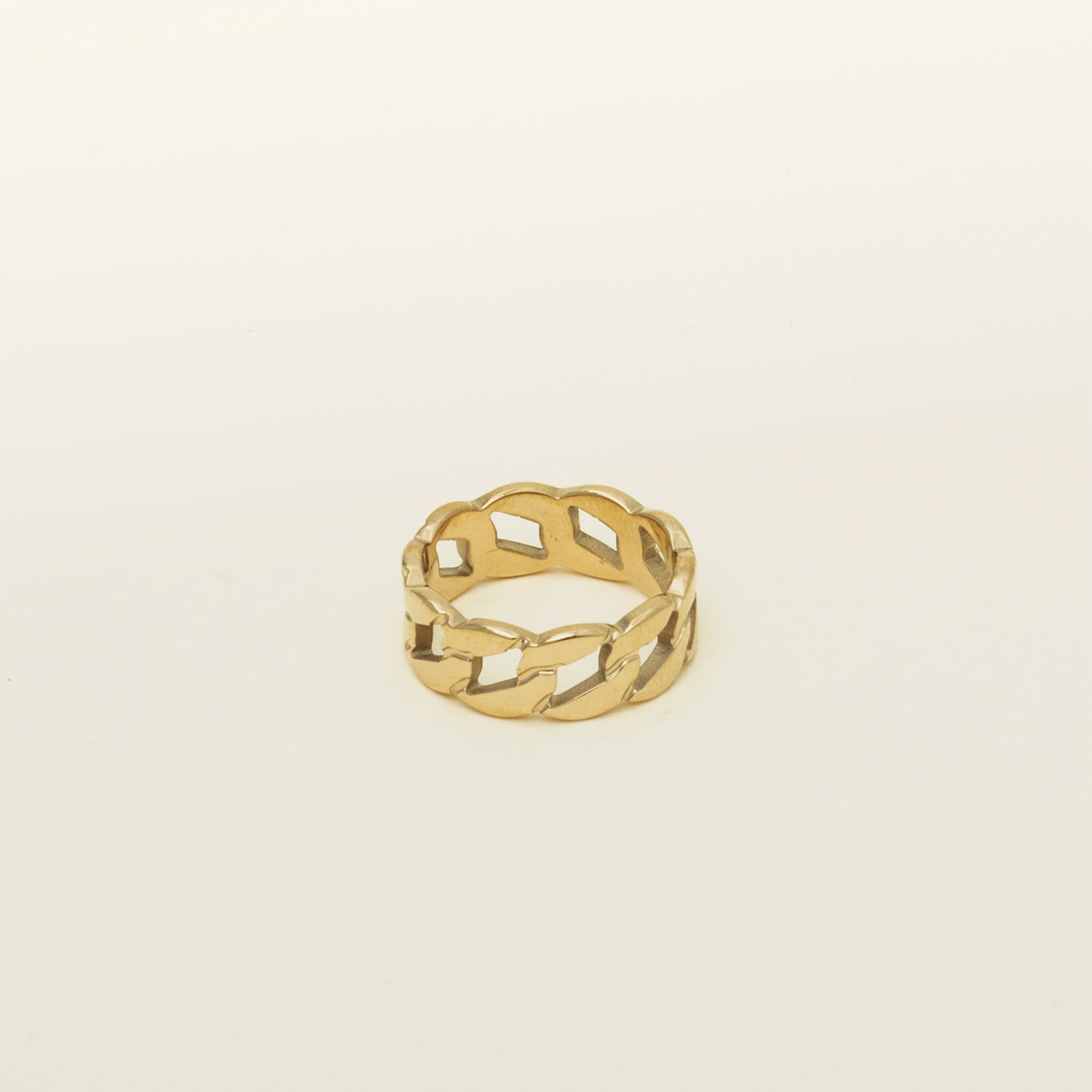 Image of the Cuban Link Chain Ring, crafted with 18K gold plating on stainless steel, delivering dependable protection from discoloration and water damage. Its unique design exudes a fashionable air, certain to make an impression.